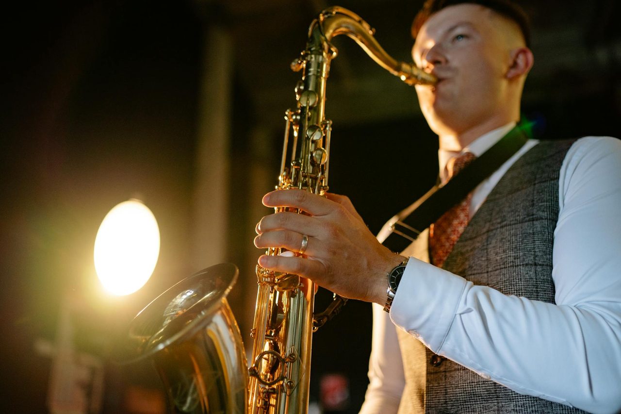 A saxophonist performing at a LIV event