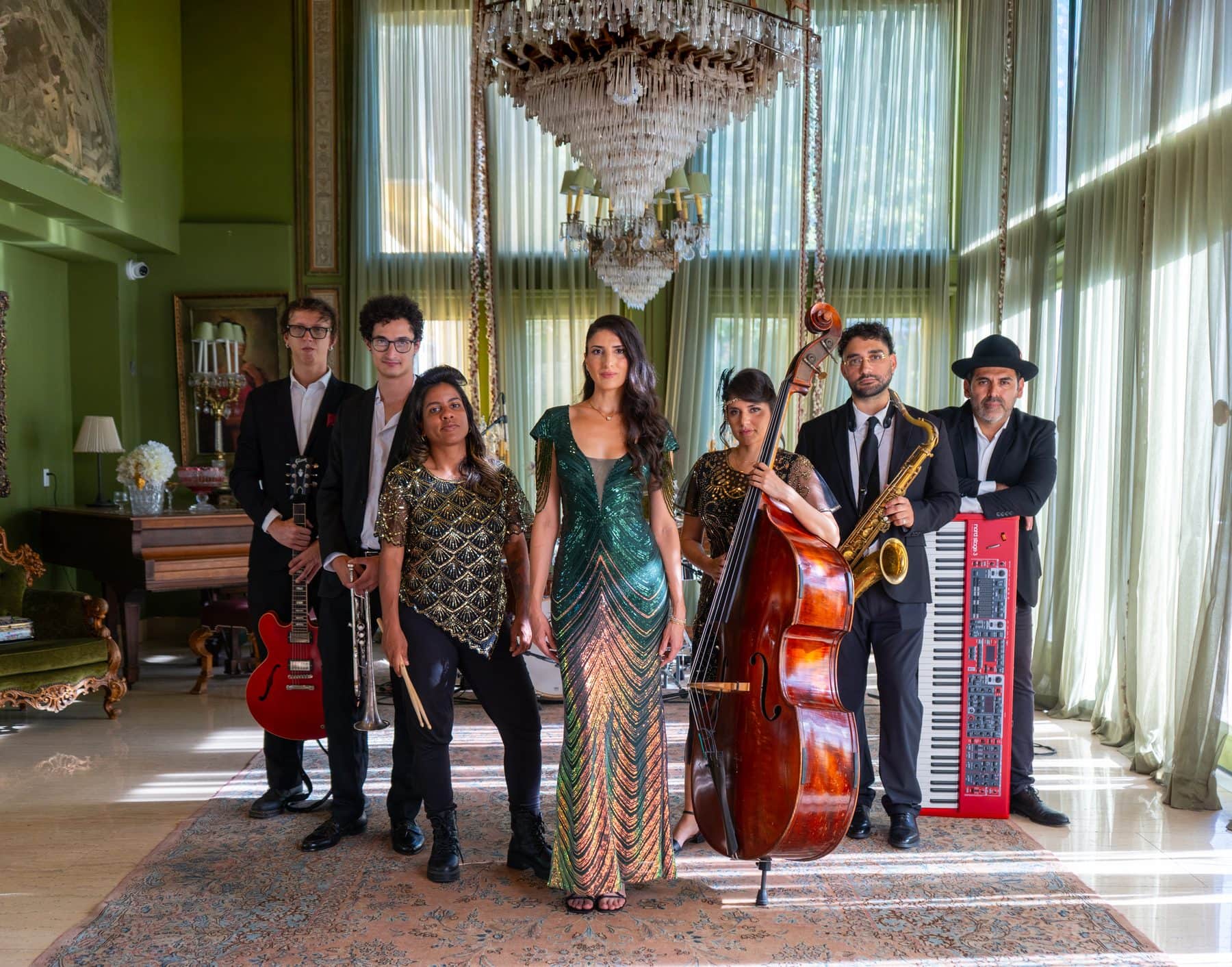 Rubato, one of LIV's in-house bands, with upright bass, sax, red guitar and red keyboard in a ballroom