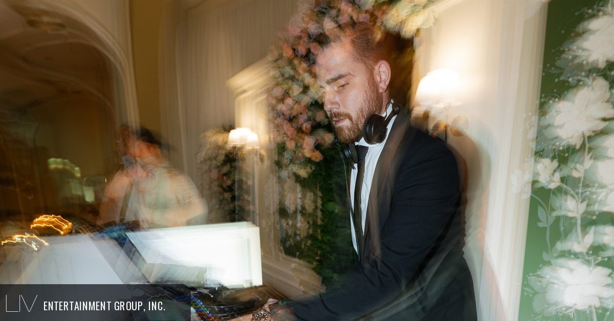 A good DJ reading the room from the booth at a wedding reception