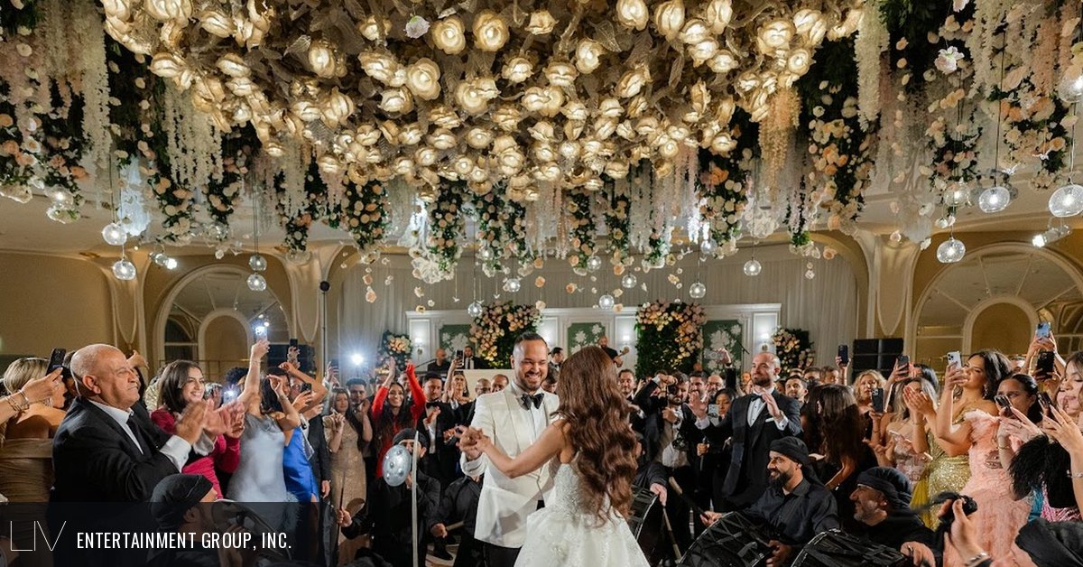 Luxury party entertainment under floral chandeliers in a hotel ballroom