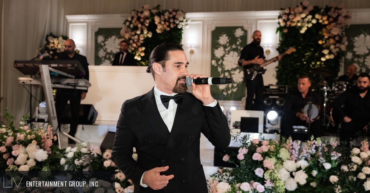 Live band vocalist performing at a party, one of the costs in a band quote