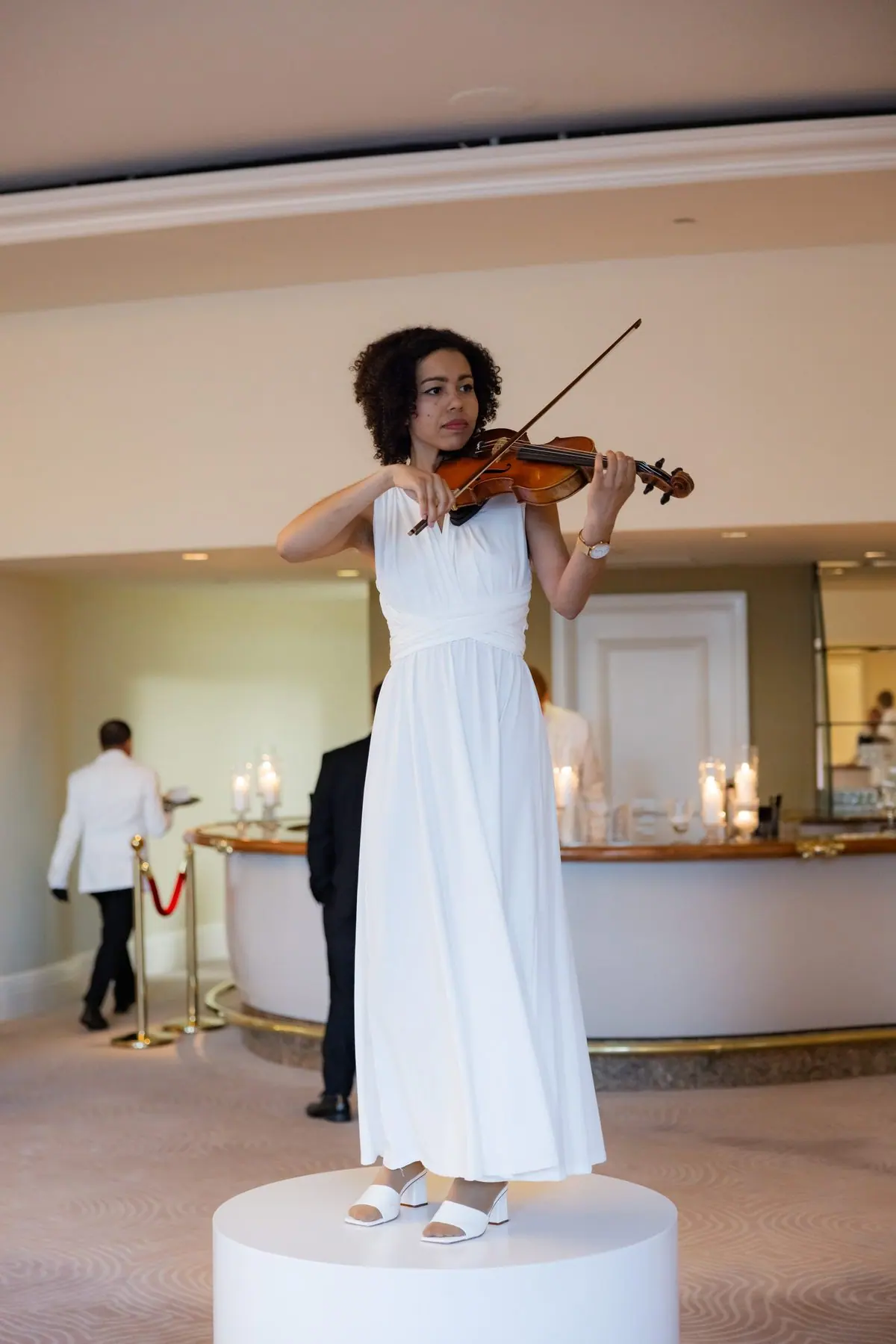Violinist from LIV Entertainment playing at a ceremony