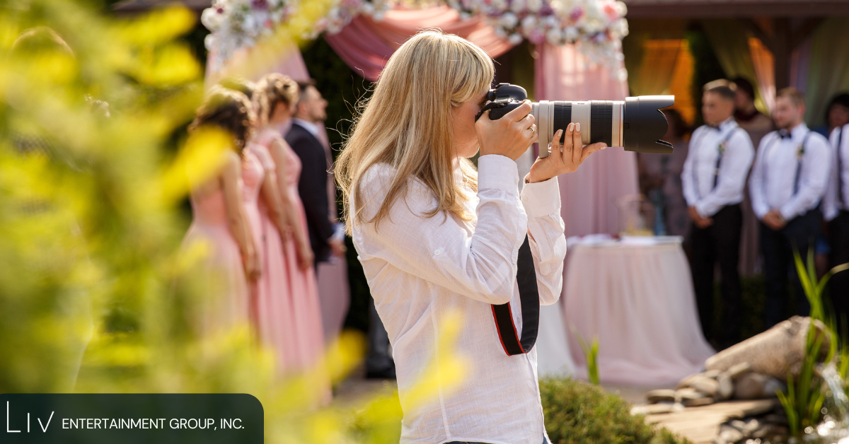 Wedding photographer capturing an outdoor ceremony